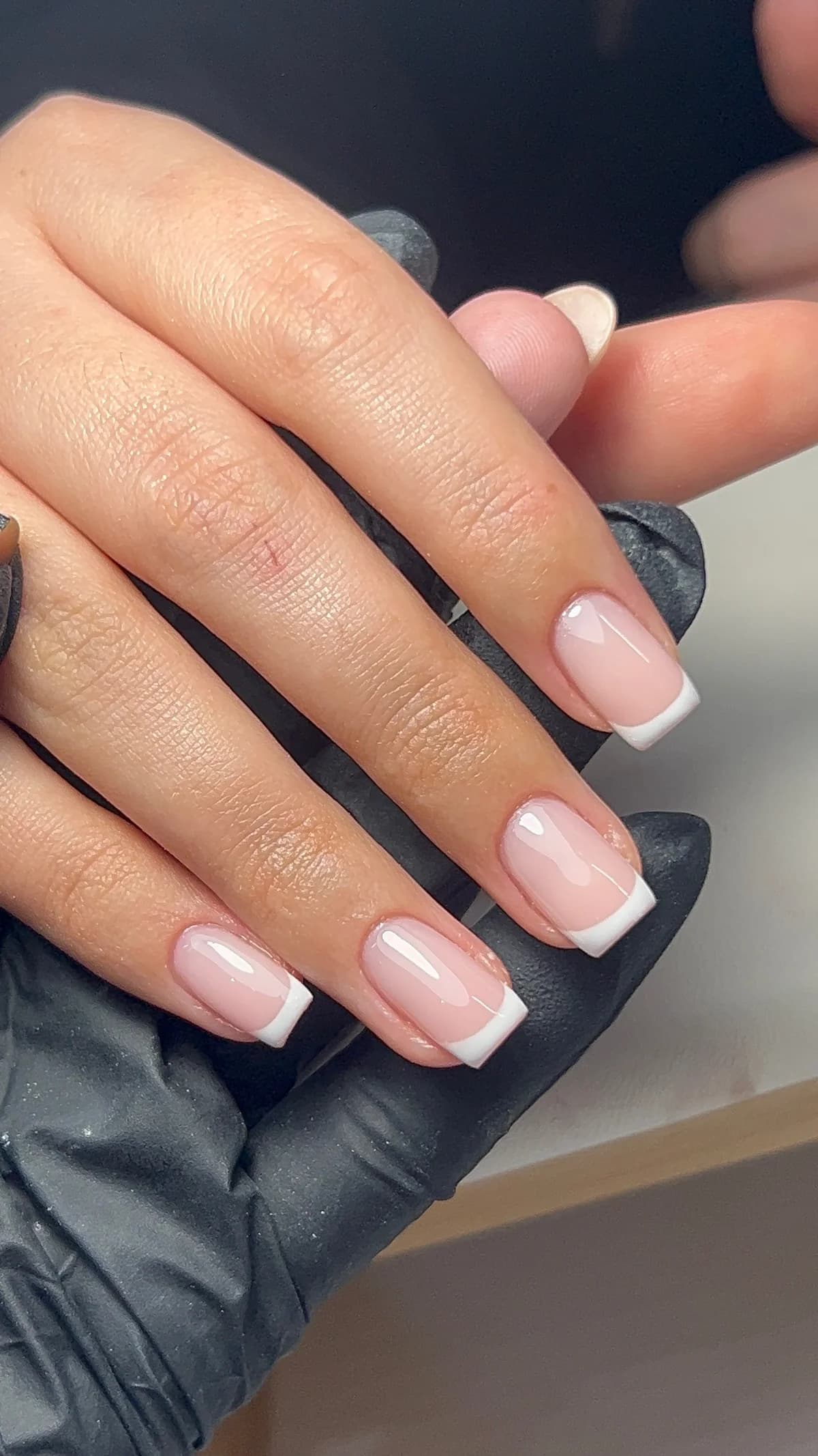 Pink and white French tip nails after an infill by Jolie in Tonypandy