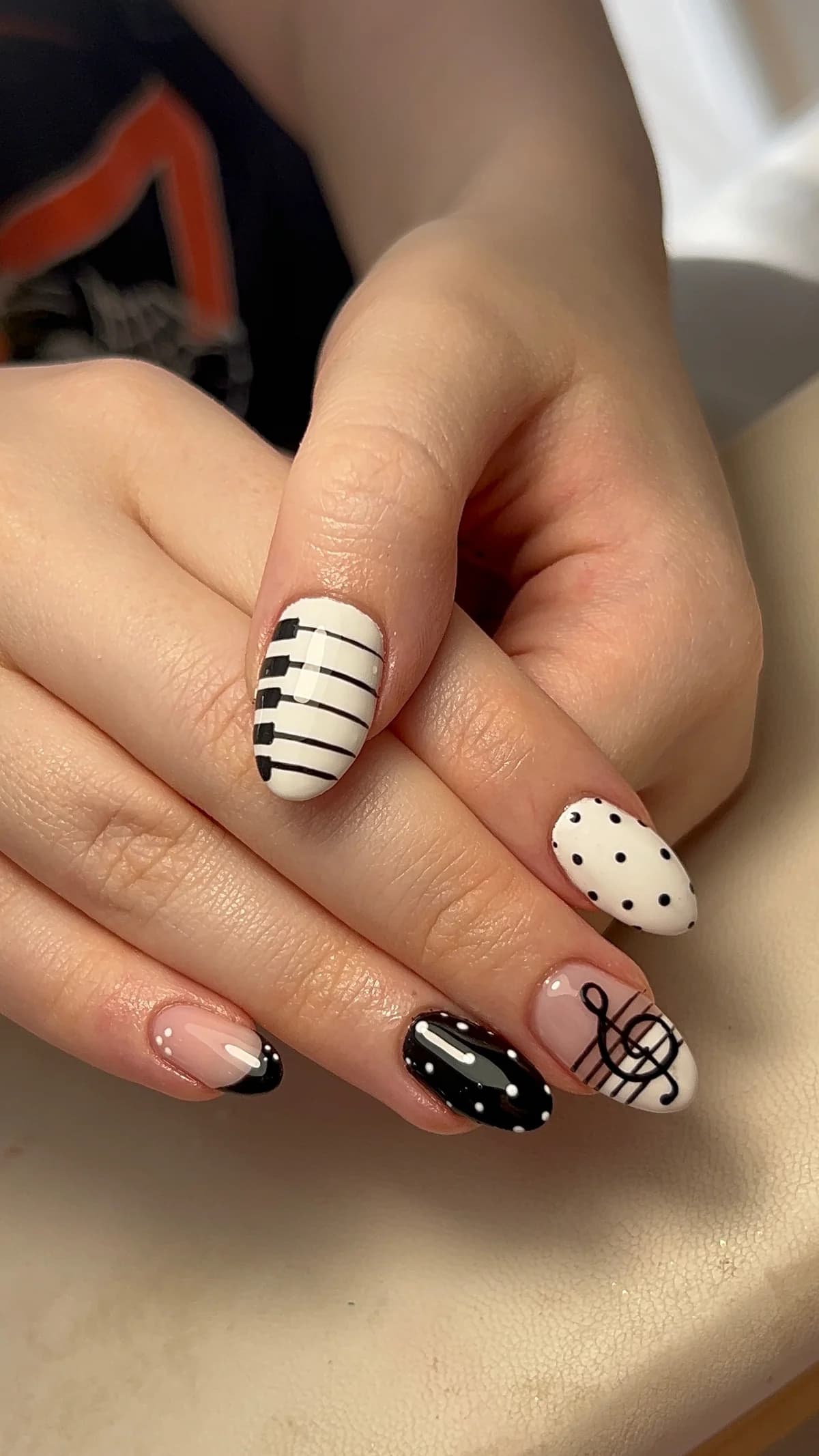 Black and white piano keys and musical note nail art after an infill